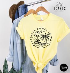 Happiness Comes In Waves Shirt, Positive Gift for Women, Summer Vibes Tee, Beach Vacation Top, Inspirational Sun T-Shirt, Family Trip Shirt Welcome to Icarus Custom Shirts ( https://www.etsy.com/shop/IcarusCustomShirts ), our online haven of artistic expression. Discover a world of trendy and custom designs, made just for you, to express your unique style. From funny quotes to artistic creations, browse through our diverse collection, find the perfect design to make a statement and let your pers Printed Yellow T-shirt For Vacation, Yellow Printed T-shirt For Vacation, Yellow Summer Shirt With Funny Print, Yellow Funny Print Shirt For Summer, Summer Yellow Shirt With Funny Print, Yellow Graphic Print Top For Beach Season, Vacation Crew Neck Tops With Screen Print, Screen Print Crew Neck Top For Vacation, Crew Neck Tops With Screen Print For Vacation