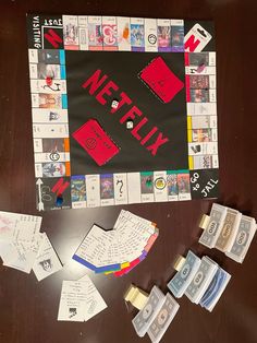 a wooden table topped with lots of papers and magnets