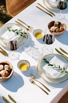 the table is set with plates and silverware