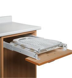 an open drawer on the side of a desk