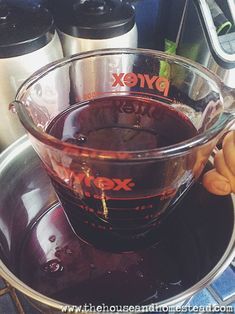 a bowl filled with liquid sitting on top of a counter