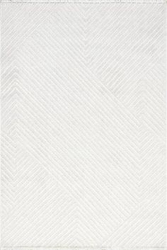 a white rug with an abstract design on it