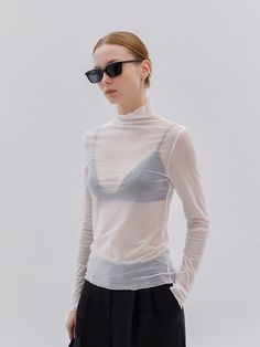 Softly structured, this effortless top.It is exceptionally soft and durable.Great outfits start here. - Lightweight sheer fabric top - Long sleeves and high neck - This top with the perfect pop of pretty- It's stretchy, so they hold you in and lift you up.- Soft and flowy, this top is the kind of layer we want to finish every outfit Sheer White Top Outfit, Mesh Long Sleeve Top Outfit Layered, Sheer Long Sleeve Top Outfit, White Sheer Top Outfit, Chic White Sheer Mesh Top, Mesh Long Sleeve Top Outfit, White Sheer Stretch Top, Sheer Blouse Outfit