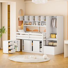 a white bunk bed sitting in a bedroom next to a desk and chair with drawers