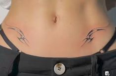 a woman's stomach with two birds drawn on it and a button in the middle