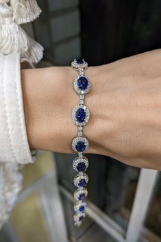 Elevate your aesthetic with our stunning blue sapphire bracelet, a modern take on a timeless classic. Embracing the latest jewelry trend, this piece combines the allure of a dreamy blue sapphire with a sleek, modern design. Perfect as a gift or to complement your wedding ensemble, this custom jewelry piece is far from traditional. Ditch the conventional diamond and opt for a non-traditional, yet undeniably chic alternative. Traditional Jewelry, Modern Elegance, Timeless Classic