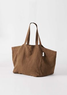 Your go-to carry-all bag. Designed for beach days, market trips and weekends away. Made from 100% soft linen in the perfect size to fit all your daily essentials. Product Specs 100% linen Interior pocket Lined base Machine washable 14 x 14 x 14" Lightweight, unstructured style Available in latte, slate blue, bottle green and chocolate Care Instructions For small stains, spot clean using cold water and a mild soap or detergent. Alternatively, machine wash cold on gentle cycle, do not bleach. Stea Casual Brown Linen Bag, Summer Linen Shoulder Bag For Everyday Use, Natural Linen Shoulder Bag For Everyday Use, Daily Use Linen Shoulder Bag, Brown Linen Bag For Everyday Use, Everyday Natural Linen Shoulder Bag, Everyday Natural Linen Bags, Casual Natural Linen Canvas Bag, Summer Linen Canvas Bag For Everyday Use