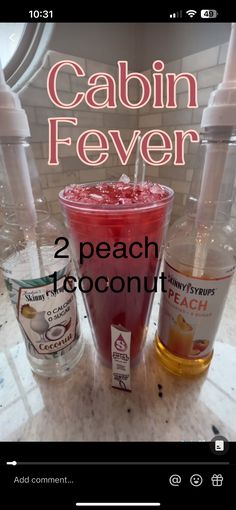 two bottles of vodka and one bottle of alcohol on a counter top with the caption cabin fever 2 peach coconut punch