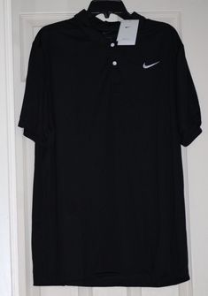 BRAND NEW WITH TAG Nike Dri-FIT Victory Golf Polo Men's XL (44"-48.5" Chest, 38"-43" Waist) Standard fit short sleeve polo with Nike Dri-FIT fabric that wicks sweat, keeping you cool, dry and comfortable Embroidered Nike white "swoosh" logo 2 button placket 100% polyester Measurements: Chest: 25.5" (armpit to armpit), Length: 29" (top of shoulder to bottom of hem) Nike Short Sleeve Polo Shirt For Sports, Nike Sporty Short Sleeve Polo Shirt, Embroidered Nike, Black Polo Shirt, Black Polo, Swoosh Logo, Mens Golf, Nike White, Shirt Short Sleeve