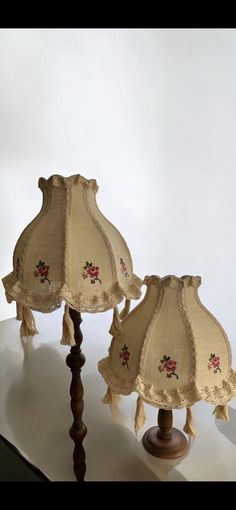 two lamps are sitting on a table