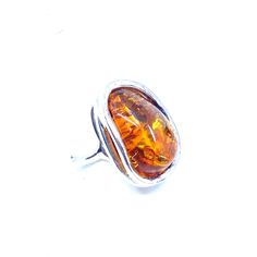 So shiny and sparkling! Silver layered setting for an extra touch! Stones: Cognac Baltic Amber SKU: AMRG020624-05 Dimensions: 1" long x 3/4 "wide x 1/2" depth Sizes adjustable 7.5 to 9 Material: .925 Sterling Silver Made In: Poland Adjustable Amber Open Ring Jewelry, Adjustable Amber Open Ring, Oblong Jewelry With Polished Finish For Anniversary, Adjustable Oblong Jewelry As A Gift, Adjustable Sterling Silver Ring With Amber Color, Adjustable Sterling Silver Amber Ring, Adjustable Amber Cabochon Rings, Adjustable Sterling Silver Rings In Amber, Adjustable Cabochon Ring For Formal Occasions