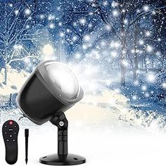 an image of a snow scene with a lamp and remote control in the foreground