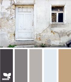 an old building with some paint samples in front of it and the door is open