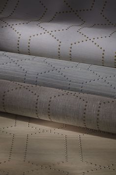 three different types of upholstered fabric with gold dots on the top and bottom