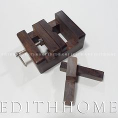 a pair of wooden clamps sitting on top of each other