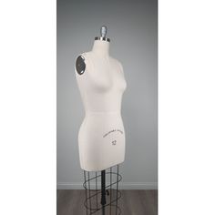 a white mannequin on a metal stand