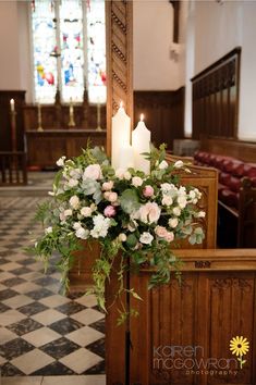 flowers and candles are placed on the alter