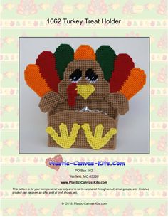 a crocheted turkey sitting in a basket