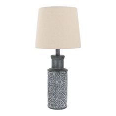 a table lamp with a white shade on it and a black vase in the middle