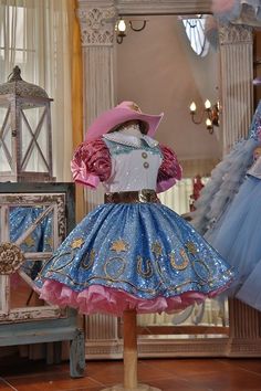 a dress and hat on display in a room