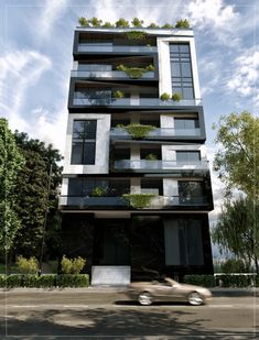 a car driving past a tall building with balconies and plants on the windows