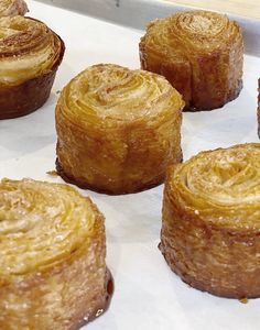 several pastries sitting on top of a baking sheet