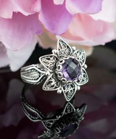 Amethyst Silver Victorian Lotus Flower Ring, 925 Sterling Artisan Handmade Filigree Floral Purple Cocktail Ring, Women Statement Ring Purple stone ring, vintage ring gift, Anniversary gift, floral wedding gift, silver boho jewelry, handmade lotus ring Material: 925 Sterling Silver ( NICKEL FREE ) Gemstone: Amethyst 8 mm. -The stone used in this jewelry, Amethyst Gemstone, is the February Birthstone. FREE, FAST AND TRACKABLE SHIPPING FOR ALL EU COUNTRIES AND USA. Amethyst has been thought to have many attributes throughout history, and all of them are good. The stone was thought to control evil thoughts, quicken intelligence, make a shrewd man in business, preserve soldiers from battle wounds. According to Greek mythology, Amethyst was a young virgin who became the object of wrath of the Gr Evil Eye Stone, Evil Thoughts, Silver Boho Jewelry, Lotus Flower Ring, Purple Cocktails, Purple Stone Rings, Lotus Ring, Flower Women, Ring Purple