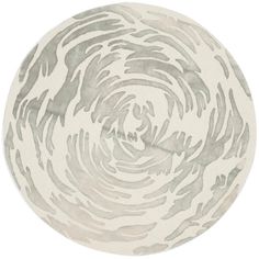 a circular rug with an abstract design in grey and white