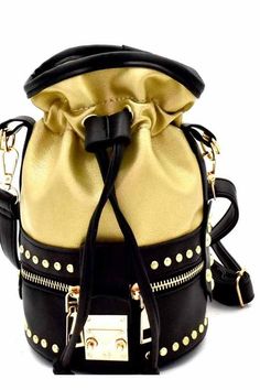 Optional adjustable shoulder strapFaux-leatherGold-tone hardwareClosure - drawstringDimensions - 5.25"L x 5.25"W x 8"H Chevron Purse, Leather Messenger Bags, Studded Backpack, Trendy Purses, Backpack Style, Stylish Handbags, Wholesale Handbags, Baby Alive, Online Fashion Store