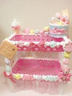 a doll house with pink and white decor