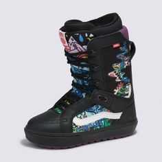 a child's snowboard boot with colorful designs