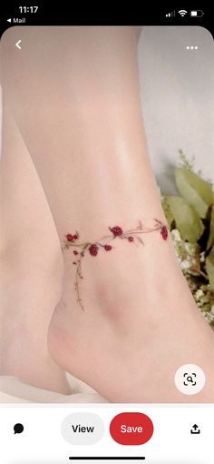 a woman's foot with flowers on it