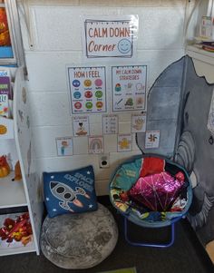 a room with stuffed animals and decorations on the walls, including a chair that is shaped like an elephant