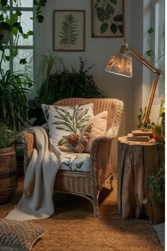 a living room filled with lots of plants next to a wooden table and chair in front of a window