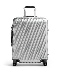 Striking from every angle, this carry-on boasts a modern silhouette with iconic, fluid-looking contours. The durable aluminum construction is designed to meet most domestic carriers' carry-on guidelines. Carry On Size, Spinning Wheels, Interior Vintage, Frequent Traveler, Carry On Suitcase, Voyage Europe, Combination Locks, Jet Setter, Outlet Store