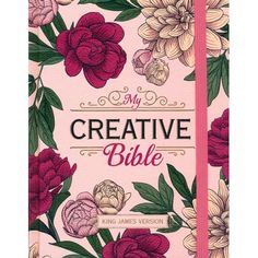 a pink notebook with flowers and the words creative bible