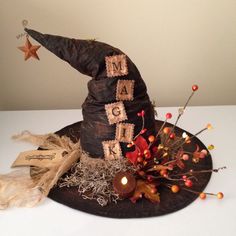 a witches hat with the word magic spelled out on it