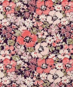 an image of a flowery fabric with pink and green flowers on it's side