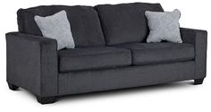 a gray couch with two pillows on it