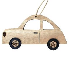 a wooden car ornament hanging on a string