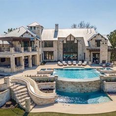 a large house with a pool in front of it