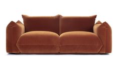 a brown couch with two pillows on it's back and one arm facing the camera