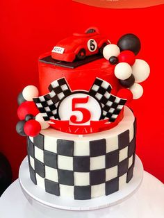 a birthday cake with a race car on top