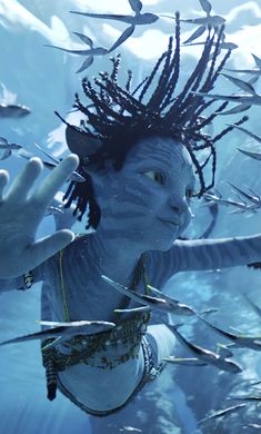 a woman with dreadlocks under water holding her hand up to the camera,