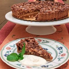 there is a piece of pie on the plate and another slice has ice cream on it