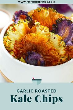 a white bowl filled with colorful flowers on top of a table