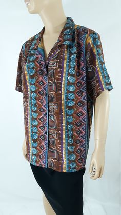 "80's Women's Shirt Short Sleeve Blue Brown Gold Turquoise Cool Geo Abstract Print Button Down Like New Vintage by HILL ARCHER Size XL Super cute fun summer vacation! Button down, black buttons, short sleeve, tiny collar, gather across shoulder, drapy silky light weight fabric, colorful. Blue brown gold pink gold geo colorblock abstract print. Excellent Condition. Easy to wear casual chic vintage for the disco sporting life. MEASUREMENTS: Length - 27\" Bust (underarms to underarms) - 23\"x 2 Sle Casual Turquoise Short Sleeve Blouse, Blue Retro Print Button-up Top, Blue Retro Tops With Buttons, Blue Vintage Blouse With Relaxed Fit, Retro Blue Collared Blouse, Retro Blue Blouse With Buttons, Blue Retro Blouse With Buttons, Vintage Blue Blouse With Button Closure, Blue Vintage Blouse With Button Closure