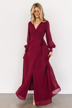 Stay occasion ready with the Kelsey Wrap Dress from Baltic Born! This gorgeous true-wrap maxi features long sleeves and emerald chiffon. Flowy Tie Waist Dress For Formal Occasions, Formal Flowy Dress With Tie Waist, Solid Long Sleeve Wrap Dress For Formal Occasions, Long Sleeve Chiffon Dress For Date Night, Formal Fall Maxi Dress With Draped Sleeves, Fall Formal Maxi Dress With Tie Waist, Formal Fall Maxi Dress With Tie Waist, Flowy Long Sleeve Dress With Tie Waist, Formal Long Sleeve Faux Wrap Dress