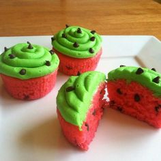 four cupcakes with green frosting and chocolate chips on top, one cut in half