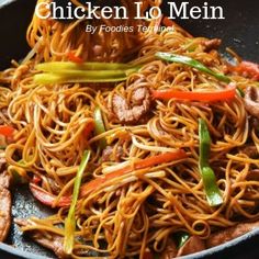 chicken lo mein in a wok with vegetables and meat on the side, ready to be eaten